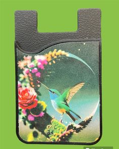 a card case with a bird and flowers on the front, featuring a hummingbird in flight