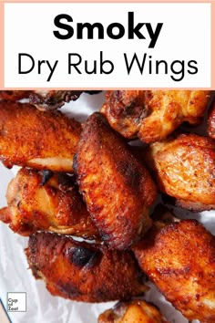 some chicken wings on a plate with the words smoky dry rub wings