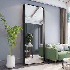 a living room filled with furniture and a large mirror mounted to the side of a wall