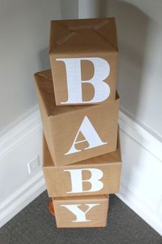 three boxes stacked on top of each other with the letters abc and y painted on them