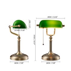 two green lamps sitting next to each other on top of a white surface with measurements