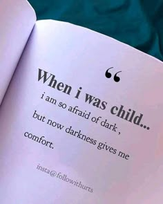 an open book with the text when i was child, i am so afraid of dark, but now darkness gives me comfort