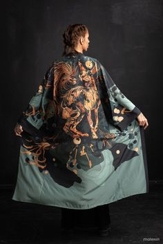 "Introducing our extra long unisex kimono robe, a wearable work of art for men and women. Designed to accompany you on your travels, keep you comfortable while lounging, turn heads at summer festivals, or elevate your daily routine. Our kimonos are a versatile addition to any wardrobe, embracing all individuals and occasions with the perfect blend of comfort and style. This listing is for our silky printed kimono, where the Sphinx cat takes center stage in a striking black and green design. Crafted to elevate your style, this kimono offers a versatile addition to your collection. Enjoy the charm of feline grace and make a statement with every wear. Explore our shop and discover the perfect fusion of fashion and art. Cats, in various cultures, are often associated with independence, intuiti The Sphinx, Sphinx Cat, Printed Kimono, New York Outfits, Summer Festivals, Printed Robe, Cat Art Print, Sphynx Cat, Print Kimonos