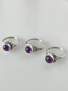 Bohemian amethyst ring is set in 925 sterling silver. This round purple coloured amethyst ring will make a perfect gift for those with those with Aquarius zodiac or those born in February. LAST SIZES  925 STERLING  SILVER - This rings is casted in solid 925 sterling silver i.e. the ring is made FULLY from 925 sterling and NOT just plated with silver.    CAN'T FIND YOUR SIZE ? - Refer to our other listings for amethyst rings:  https://www.etsy.com/au/listing/941578593/purple-amethyst-ring-amethyst-silver?ref=shop_home_active_1 https://www.etsy.com/au/listing/941555485/purple-amethyst-ring-amethyst-silver?ref=shop_home_active_2&pro=1 https://www.etsy.com/au/listing/941552563/purple-amethyst-ring-amethyst-silver?ref=shop_home_active_11&pro=1 https://www.etsy.com/au/listing/927611014/purple-am Purple Amethyst Ring, Amethyst Gem, Canberra, Purple Band, Bohemian Rings, Delicate Earrings, Minimalist Rings, Sterling Silver Studs, Fun Earrings