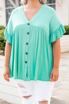 This top is too sweet! It has a flirty and feminine design with a figure-flattering fit you'll want to wear all day long! It's light and flowy and has the cutest ruffled sleeves! Not to mention how easy the solid mint color is to pair with your favorite accessories! Style this top with skinnies and wedges for an effortlessly chic look! 95% Rayon, 5% Spandex Made In USA. Cute Ruffle Sleeve Top With Ruffle Hem, Green Flutter Sleeve Tops For Vacation, Vacation Tops With Ruffle Hem And Flutter Sleeves, Flutter Sleeve Tops With Ruffle Hem For Vacation, Feminine Flutter Sleeve Top For Vacation, Cute Ruffle Sleeve Tops For Day Out, Cute Brunch Tops With Ruffle Hem, Summer Rayon Top With Ruffle Sleeves, Trendy Flutter Sleeve Tops For Vacation