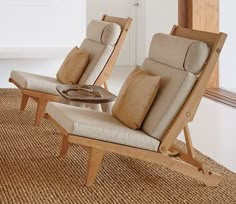 two reclining chairs sitting next to each other on top of a carpeted floor