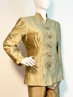 This is a gold silk suit with an Asian inspired jacket and high waist pants.  Both pieces are fully lined.  Jacket has light shoulder pads.  There are no tags on this set.  It appears to be raw silk and custom made.  No stretch.  Check measurements carefully.   Measurements taken with suit laying flat and doubled where appropriate. In order to determine fit we recommend comparing measurements with an item that fits you well. Jacket Length 28 inches Shoulder to shoulder 16 inches  Underarm to und Frog Closure, Gold Suit, Style Pant, Silk Suit, Pant Suit, Gold Silk, Asian Inspired, Asian Style, Waist Pants