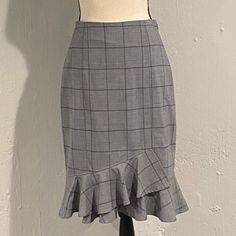 Banana Republic. Nwt. Beautiful, Grey, Windowpane, Tulip Shaped, Pencil Skirt. This Gorgeous Skirt Is Slightly Fitted With A Bit Of Stretch To Provide A Flattering Fit Perfect For The Office Or After Work Happy Hour. This Skirt Features A Ruffle, Tulip Shaped Hem And Hits Below The Knee. Wool/Spandex/Polyester Blend. Size 2, Brand New, Never Been Worn. Nwt. Elegant Fitted Plaid Skirt, Fitted Tiered Mini Skirt For Work, Elegant Plaid Skirt, Fitted Plaid Tiered Skirt, Chic Fitted Plaid Skirt, Fitted Ruffled Mini Skirt For Workwear, Fitted Mini Skirt With Ruffles For Work, Fitted Ruffled Skirt For Work, Fitted Plaid Pencil Skirt