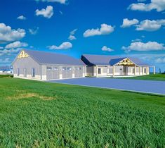 an artist's rendering of a building in the middle of a green field with blue sky and clouds