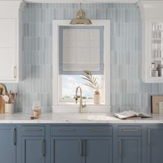 a kitchen with blue cabinets and white counter tops