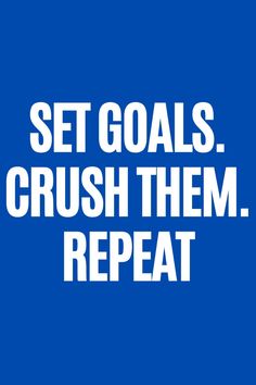 the words set goals crush them repeat on a blue background