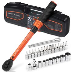 an orange and black screwdriver next to many other tools