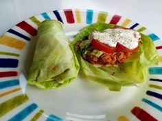 two lettuce wraps on a colorful plate