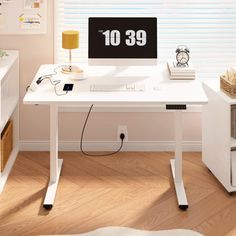 a white desk with a computer on it