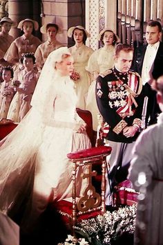 the bride and groom are surrounded by other people