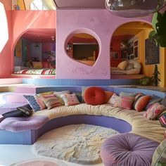 a large circular couch sitting inside of a living room