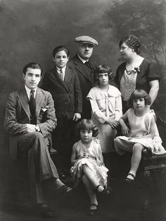 an old black and white photo of a family