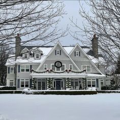 a large white house covered in christmas decorations