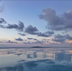 the reflection of clouds in the water is very clear and blue at sunset or dawn