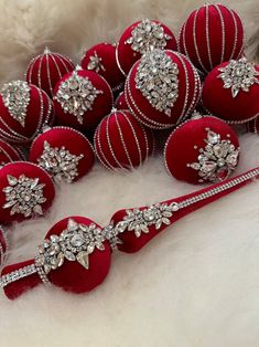 red and white ornaments are arranged on the fur