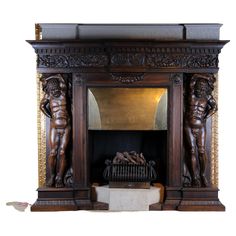 an ornate fireplace surround with carved wood figures