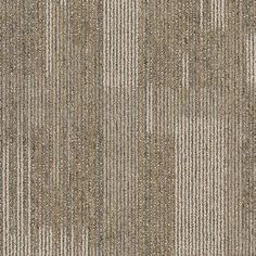 an area rug with vertical stripes in grey and beige colors on top of each other