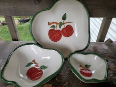 three bowls with cherries painted on them