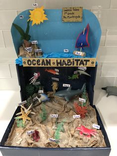 the ocean habitat is made out of cardboard and has different types of marine life in it