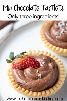 mini chocolate tartles on a white plate with strawberries