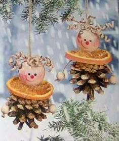 two christmas ornaments hanging from pine cones