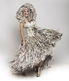 a woman in a dress made out of newspapers