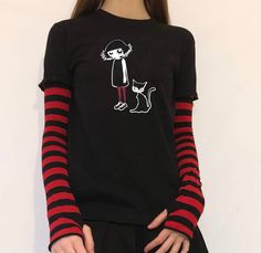 This punky top is embroidered with red stitching on the cats eye  This t-shirt is also available in other colours the stitching detail will match the sleeves primary colour. It is hand printed on a 100% cotton t-shirt with an Acidcore label.  Red & black stripe sleeves sewn into the top with thumb holes & fingerless gives this top grunge goth vibes. About Me:  Acidcore is my store based in London. All my items are hand printed with hand made transfers and some are hand embellished. My designs are inspired by different genres, gothic, fairycore, cottagecore, punk, indie. Black Striped Shirt Outfit, Gothic Fairycore, Outfits With Striped Shirts, Black Blouse Short Sleeve, Girl With Cat, Goth Vibes, Red Striped Shirt, Red And Black Shirt, Black Striped Shirt