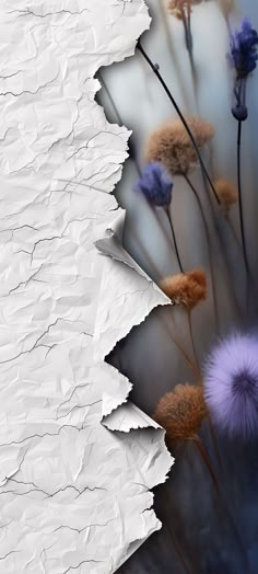 an abstract photo with some flowers on it's side and torn paper in the background