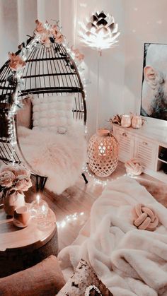 a bedroom with a birdcage and flowers on the bed in front of it