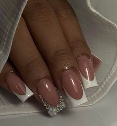 This is a simple french tip with a ring finger’s tip full of gems in a french form Classic Nails With Gems, Medium French Acrylic Nails, Short French With Rhinestone, French Nails With Ring Finger Design, Small French Tip Nails With Gems, White French Tip Nails With Jewels, Square French Tip With Gems, Short French Nails With Charms, Short White French Tip Nails With Gems