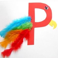 the letter p is made up of feathers and letters that are painted to look like birds