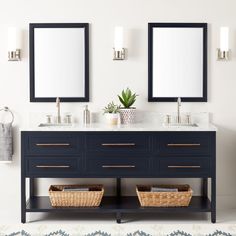 a bathroom with two sinks and mirrors on the wall next to each other in front of an area rug