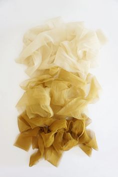 several pieces of yellow tulle sitting on top of each other