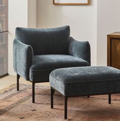 a chair and ottoman in a living room