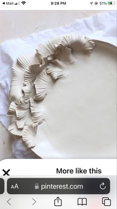 a white plate sitting on top of a table next to a piece of wax paper