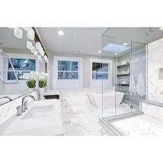 a large bathroom with marble floors and walls