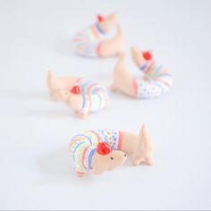 small plastic toy animals on a white surface