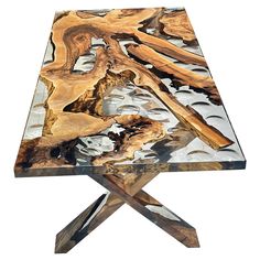 a wooden table that has been made with wood and glass on the top, as well as metal legs