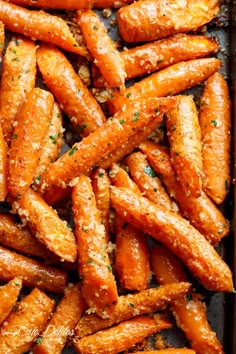 roasted carrots with parmesan cheese and seasoning in a baking pan, ready to be eaten