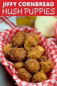 a basket filled with fried hush puppies on top of a red and white checkered table