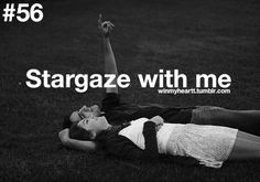 a man and woman laying on the ground with their arms up in the air, texting stargaze with me