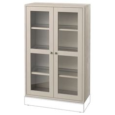 a tall white cabinet with glass doors and shelves on the bottom, in front of a white background