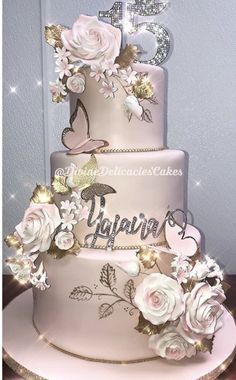 a three tiered wedding cake decorated with flowers