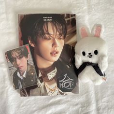 a white stuffed animal next to an album