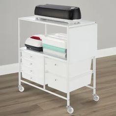 a white cart with two drawers and a printer on top